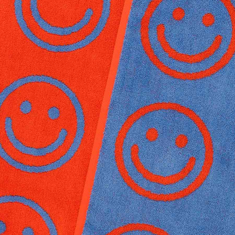 Baggu-serviette-de-bain-warm-red-happy-bleu-orange-smileys-plage-ete-Atelier-Kumo